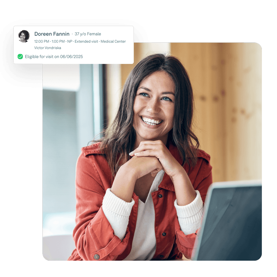Smiling billing specialist reviewing patient eligibility alert on-screen—illustrates Tebra tools for in-house billers to automate eligibility checks and claim workflows